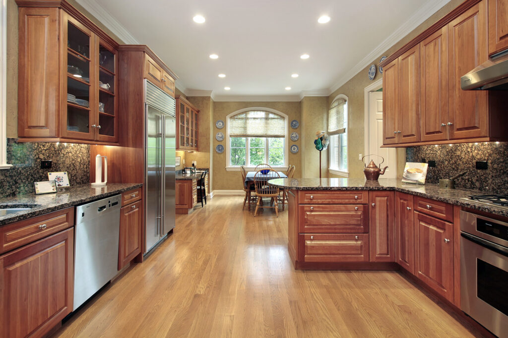 Beautiful modern kitchen with hardwood flooring.