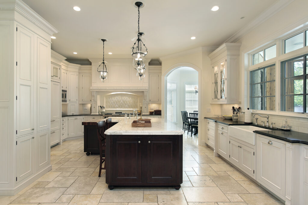 Luxury kitchen in suburban home with white cabinetry